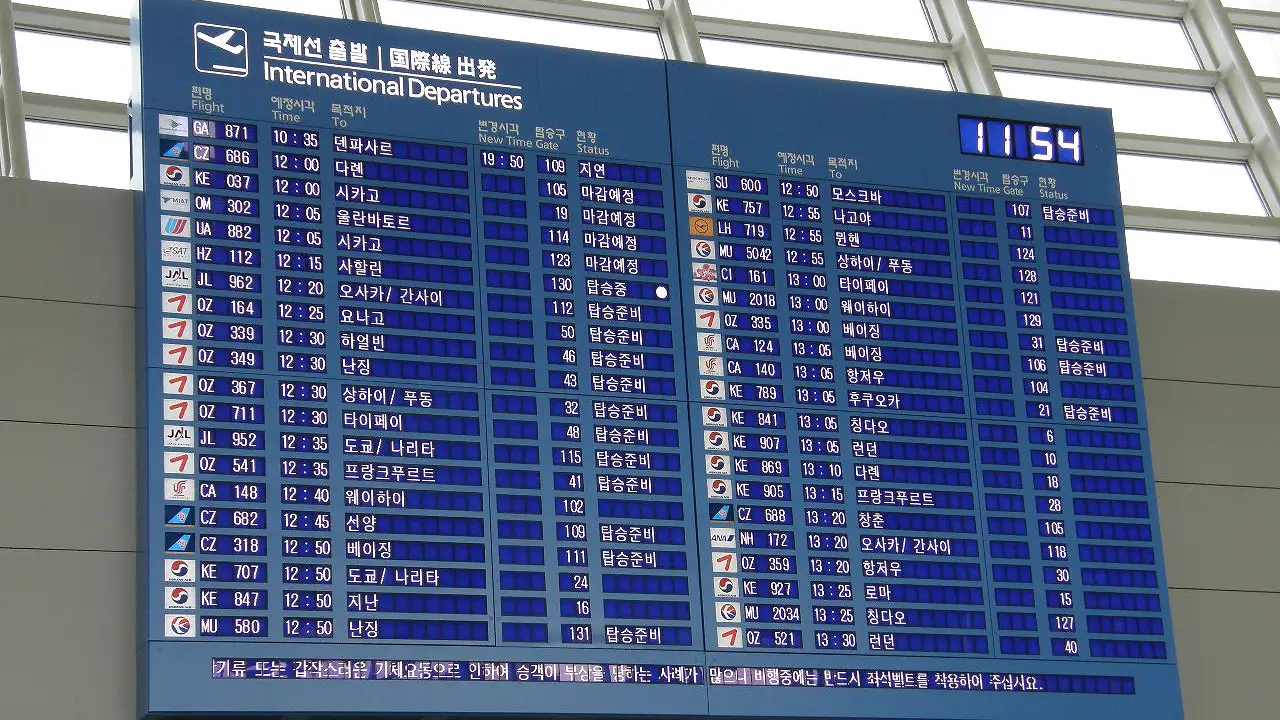 The international departures board at Incheon International Airport, with status messages such as delayed, boarding soon and closing listed beside each flight