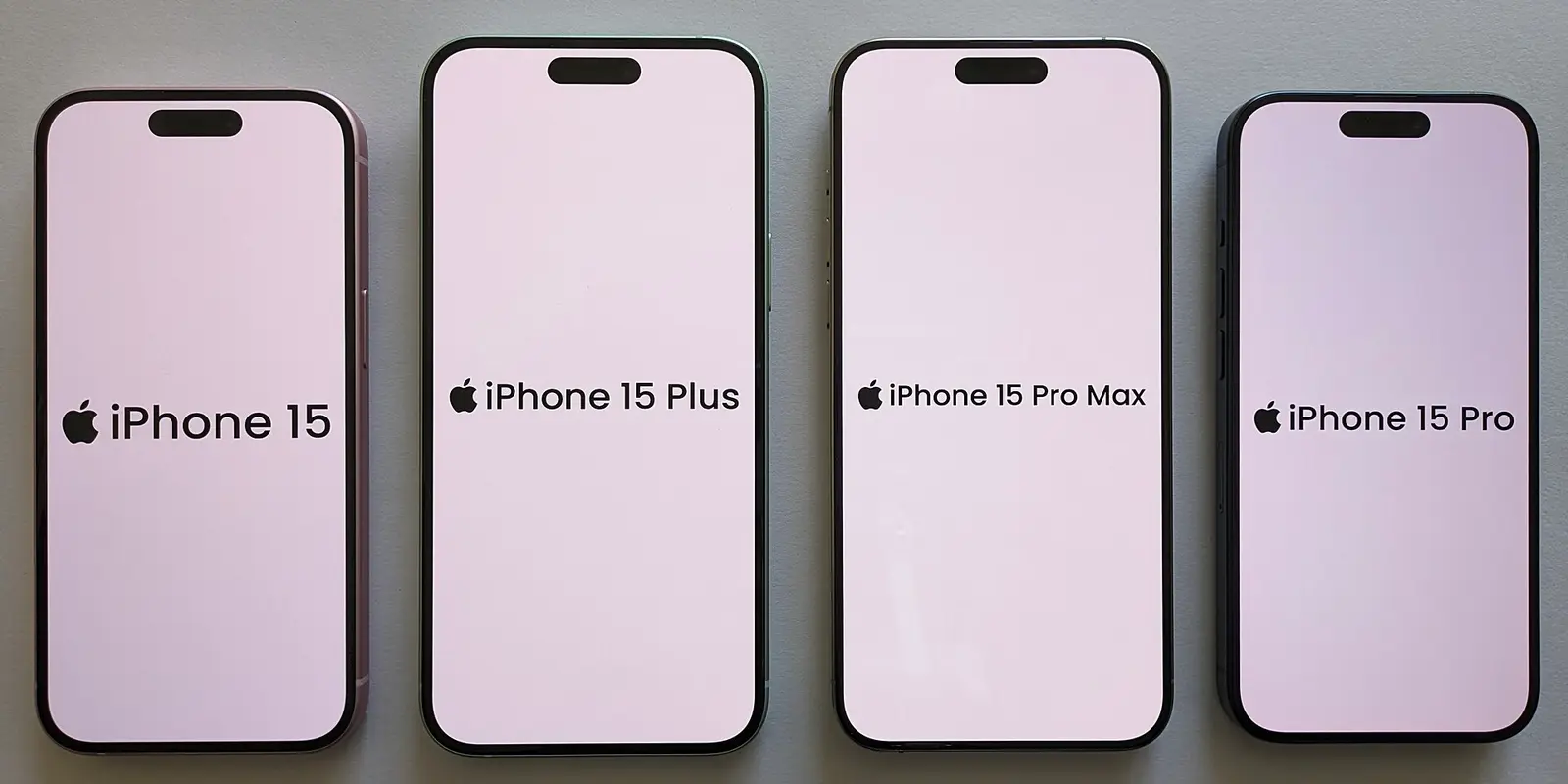 Four iPhones side by side: iPhone 15, 15 Plus, 15 Pro Max and 15 Pro