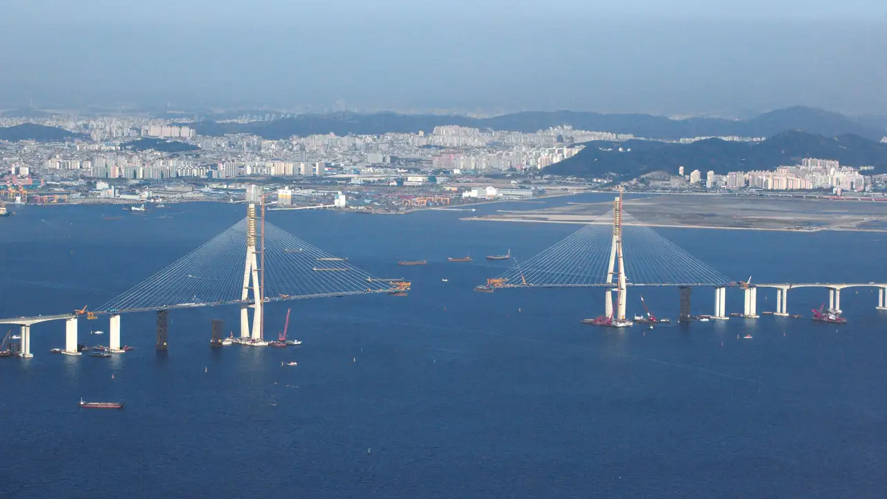 The Incheon Bridge under construction and the city of Incheon, seen from an airplane window just before landing at Incheon International Airport