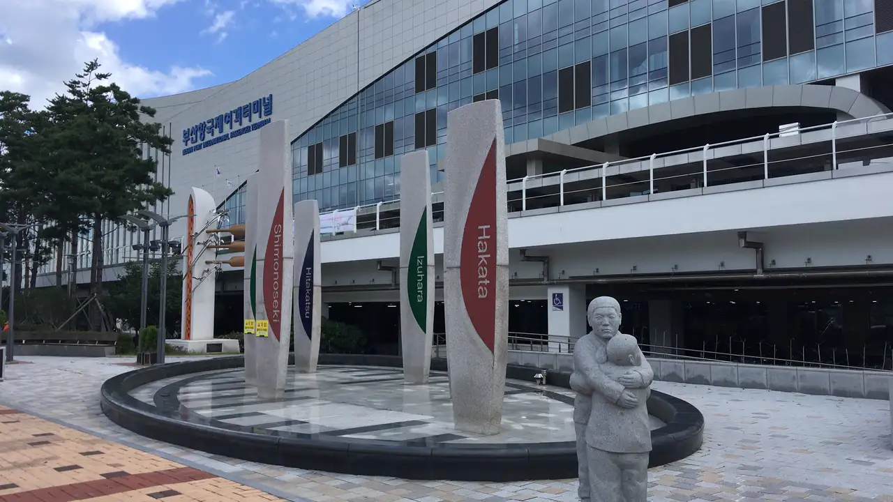 The plaza in front of Busan Port International Passenger Terminal, with stone pillars bearing the names of Japanese ports such as Hakata, Shimonoseki, Izuhara and Hitakatsu