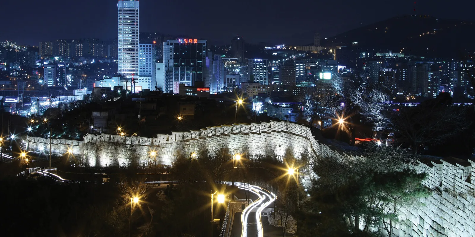 The floodlit Naksan section of the Seoul City Wall at night